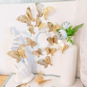 Golden 3D hollow butterfly wall stickers set with intricate metallic patterns for home decor