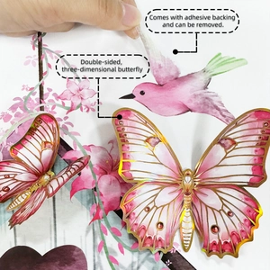 Detailed view of 3D pink butterflies with gold edges and removable adhesive backing