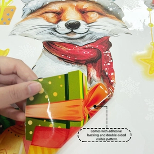 Detail of double-sided Christmas window sticker showing the fox pattern and adhesive backing