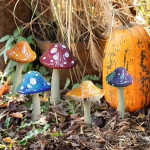 Five colorful mushroom garden stakes set with glossy finish for outdoor yard decoration