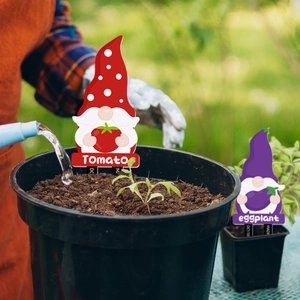 Garden gnomes vegetable markers for tomato and eggplant in outdoor flower pots