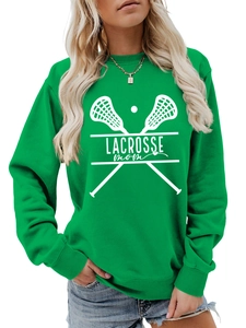 Close-up of Lacrosse Mom sweatshirt print featuring white text and sticks on green fabric