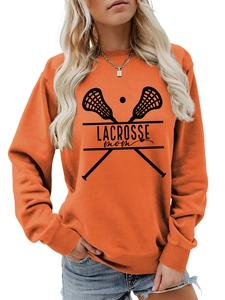 Close-up of orange Lacrosse Mom sweatshirt showing black graphic print and ribbed cuffs