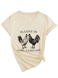 Detail of V-neck beige t-shirt with rooster graphic and Fluent in Fowl Language print