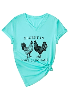 Detail of mint green V-neck t-shirt with Fluent In Fowl Language rooster print