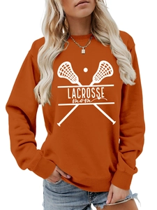 Close-up of Lacrosse Mom orange crewneck sweatshirt with white graphic print detail