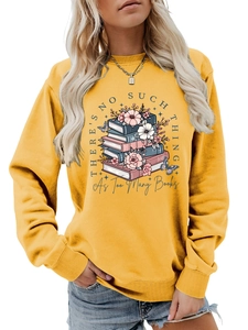 Detail of crewneck sweatshirt showing mustard yellow fabric and book floral art print