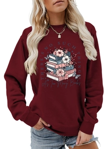 Detail of burgundy sweatshirt featuring floral book stack print and quote on chest
