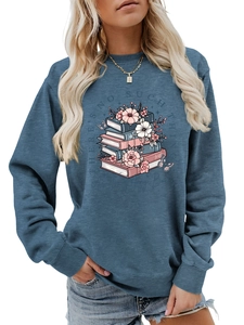 Detail of round neck sweatshirt with book illustration and floral graphic print