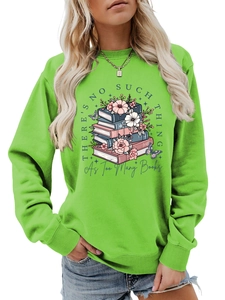 Detail of green crewneck sweatshirt featuring floral book and butterfly print