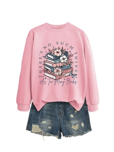 Detailed flat lay of pink crewneck sweatshirt with book and flower print with denim shorts