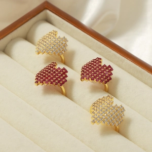 Gold plated open rings with red and white zircon stones in geometric pave setting