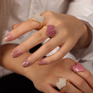 Chic gold copper rings set with pixelated red and white heart cubic zirconia
