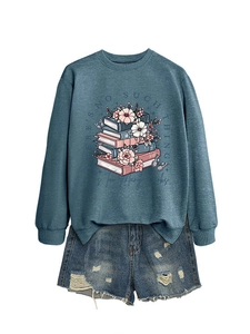 Detail of grey-blue sweatshirt with book illustration and distressed denim shorts