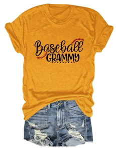Flat lay of yellow Baseball Grammy t-shirt with distressed denim shorts on white background