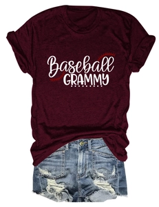 Detail of burgundy Baseball Grammy T-shirt with distressed denim shorts on white background