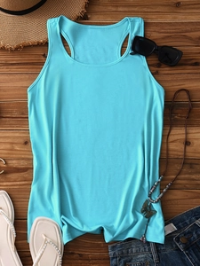 Flat lay of blue tank top with summer accessories like sunglasses and straw hat