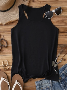 Black ribbed racerback tank top styled with summer accessories on a wooden background