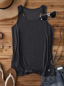 Flat lay of dark grey ribbed tank top with summer accessories on wooden background