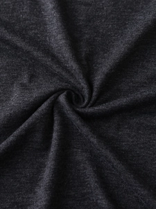 Detailed close-up of dark grey heathered knit fabric showing soft texture and drapes