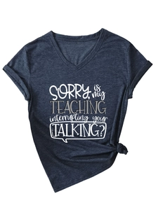 Detail of V-neck navy blue t-shirt with slogan print and stylish front knot design