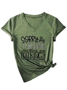 Detail of army green V-neck T-shirt with rolled sleeves and creative graphic print