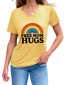 Detail of Free Mom Hugs rainbow print on mustard yellow V-neck short sleeve T-shirt