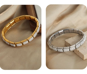 Macro detail of gold and silver square link bracelets with sparkling crystal pavé setting