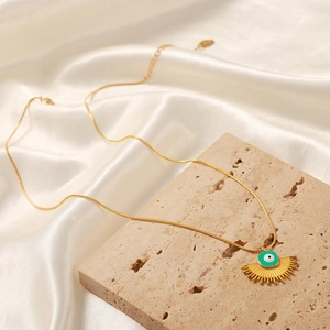 Evil eye geometric fan pendant necklace in 18k gold plated titanium steel on travertine