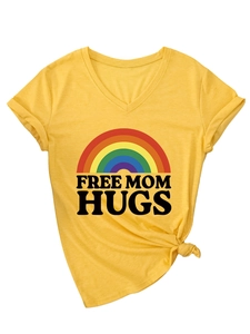 Detail of V-neck T-shirt showing rainbow graphic and Free Mom Hugs text on yellow cotton