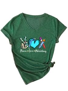 Close-up of forest green V-neck T-shirt featuring Peace Love Phlebotomy medical graphics