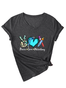 Detail of V-neck T-shirt featuring Peace Love Phlebotomy leopard print design and syringe