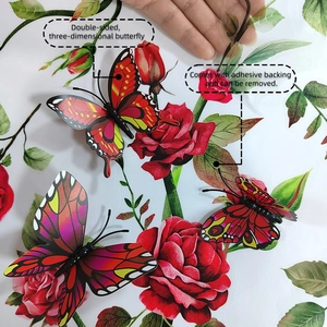 Detail showing 3D red butterfly and rose wall sticker with self-adhesive backing