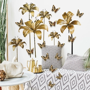 Detailed wall sticker set featuring golden lily flowers and butterflies in a home setting