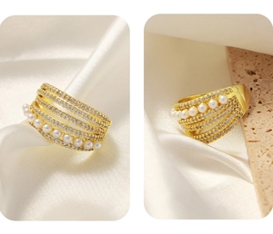 Detail of gold multi-layer ring featuring white pearls and shimmering cubic zirconia stones