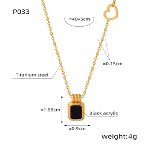 Macro detail of gold-plated titanium steel necklace with black acrylic square pendant