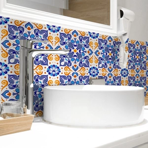 Mediterranean floral tile stickers applied as a waterproof backsplash in a bathroom