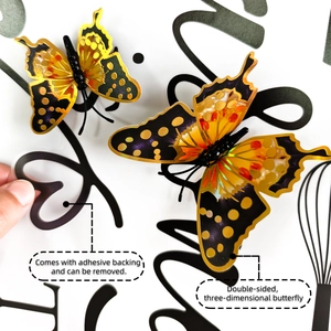 Detail of 3D yellow and orange butterfly wall stickers with gold edges and adhesive backing