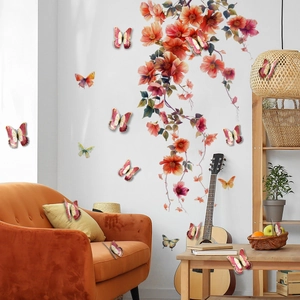 Detailed view of 3D gold-stamped butterfly wall stickers with floral vine decals in a living room
