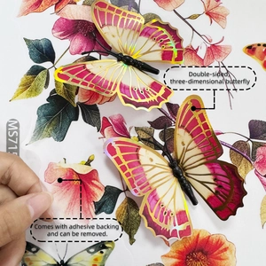 Detailed view of 3D pink and gold butterfly wall sticker showing adhesive backing and fold line
