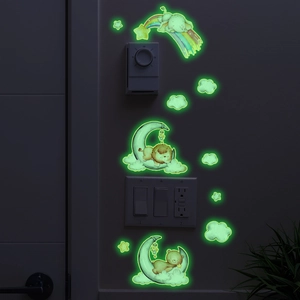 Glow in the dark wall stickers featuring cartoon animals stars moon and rainbow for nursery