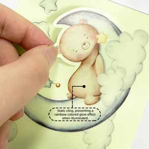 Detail of static cling rainbow wall sticker showing bear on moon and stars decoration