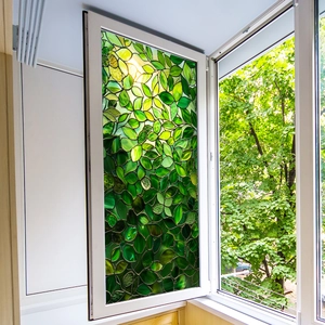 Detail of green leaf static window film showing translucent texture and double-sided print