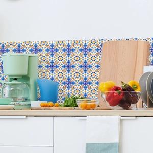 Detail of vintage blue and orange floral kitchen wall tiles in a modern lifestyle setting