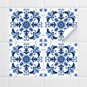 Detail showing self-adhesive backing on blue and white retro tile stickers for easy use
