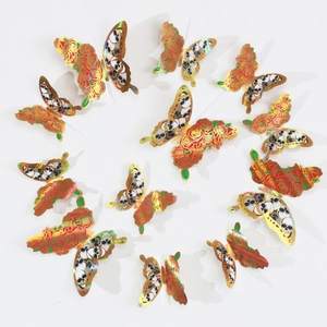 Detail view of 12pcs gold-edged butterfly wall stickers with skull and red rose motifs