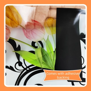 Close-up of translucent tulip flower wall sticker with adhesive backing and vine pattern