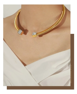Detail of 18k gold-plated C-shaped choker with sparkling pavé-set crystals on square ends
