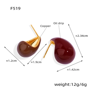 Detail view of teardrop earrings in brown and burgundy enamel with gold-plated copper