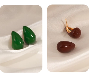 Detail of waterdrop stud earrings in deep green and brown with 18k gold plating